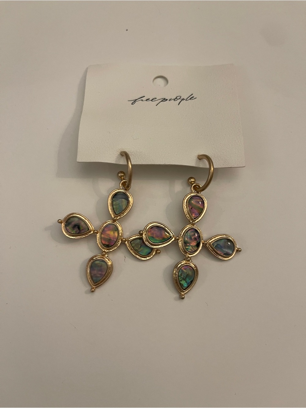 Free people cross earrings